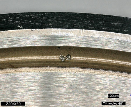 Observation of damage on the race of the bearing (50x)